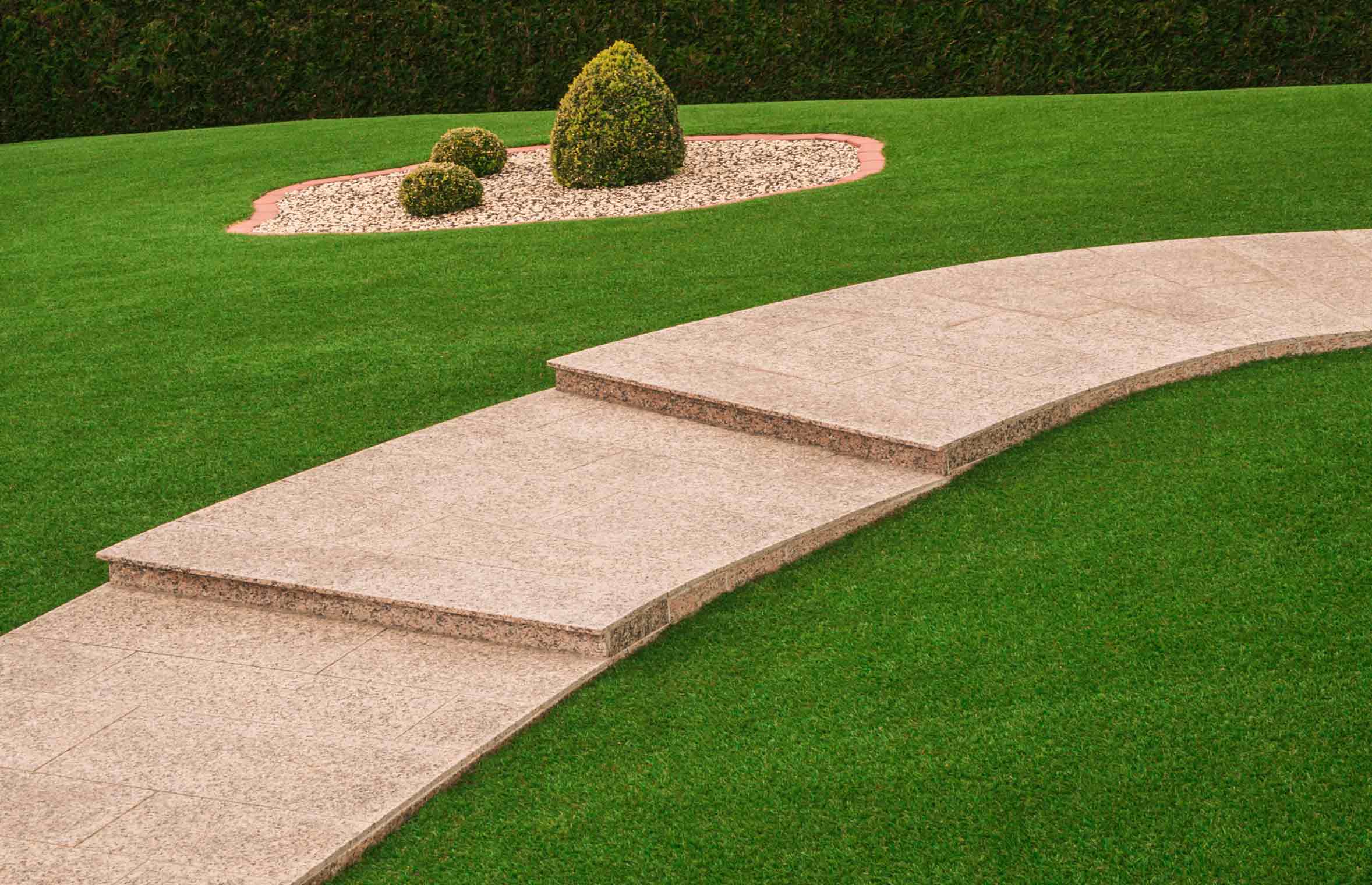 stone path walkway and artificial grass lawn